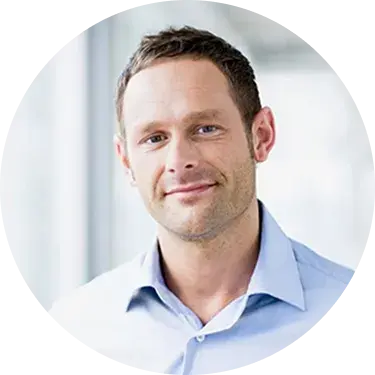 A smiling woman with short brown hair